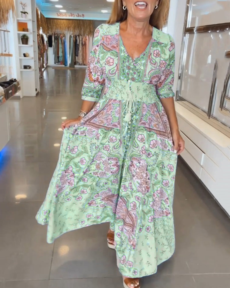 Escote V y cintura ajustable: Vestido maxi bohemio estampado, perfecto para el verano.