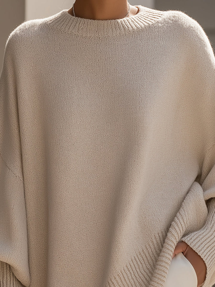 Detalle de tejido en poncho jersey oversize para mujer, algodón suave que aporta calor y estilo.