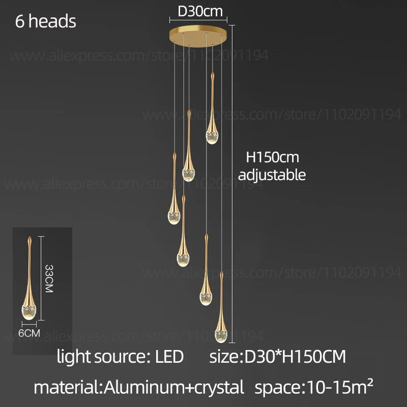 Moderna lámpara colgante dorada con lágrimas de cristal, ideal para comedor o salón.