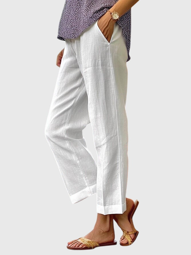 Pantalones Ángela elegantes y versátiles para mujer, ideal para oficina o look casual de verano, disponibles en blanco.