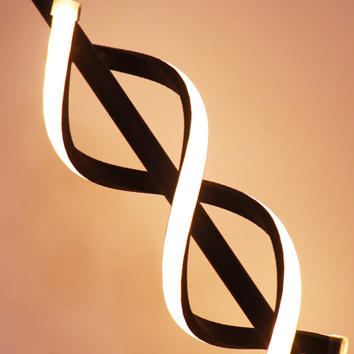 Lámpara de mesa nórdica LED espiral, ideal para dormitorio u oficina. Aporta luz moderna y ambiente.