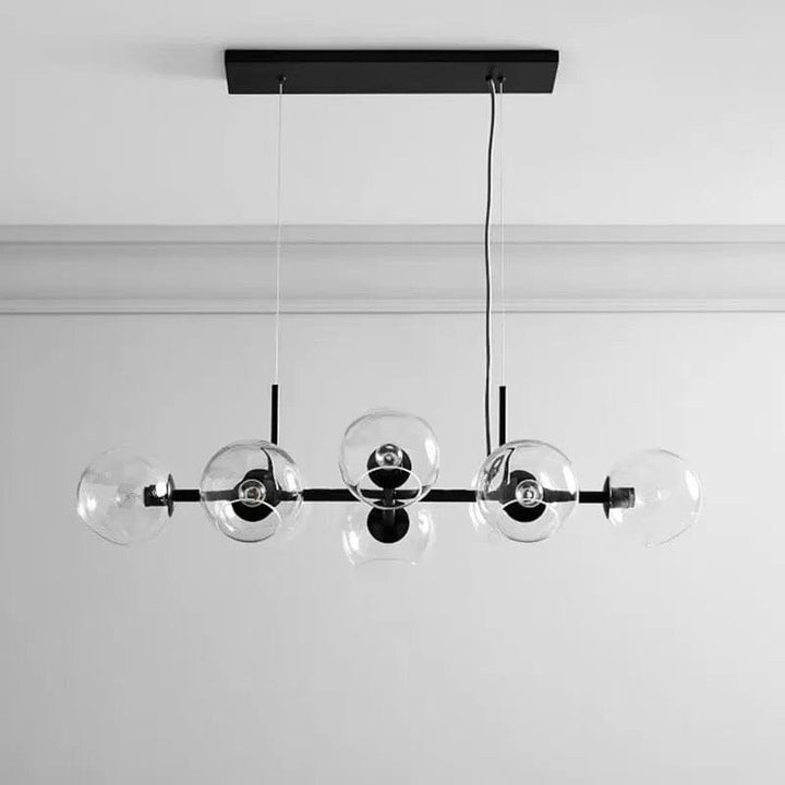 Araña moderna de burbujas LED, perfecta para decorar salones con un toque de oro y negro.
