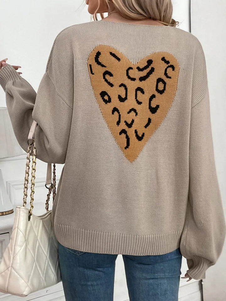 Chaqueta de punto de mujer con patrón de corazones y lazo. Manga larga, estilo coqueta y versátil para moda femenina.