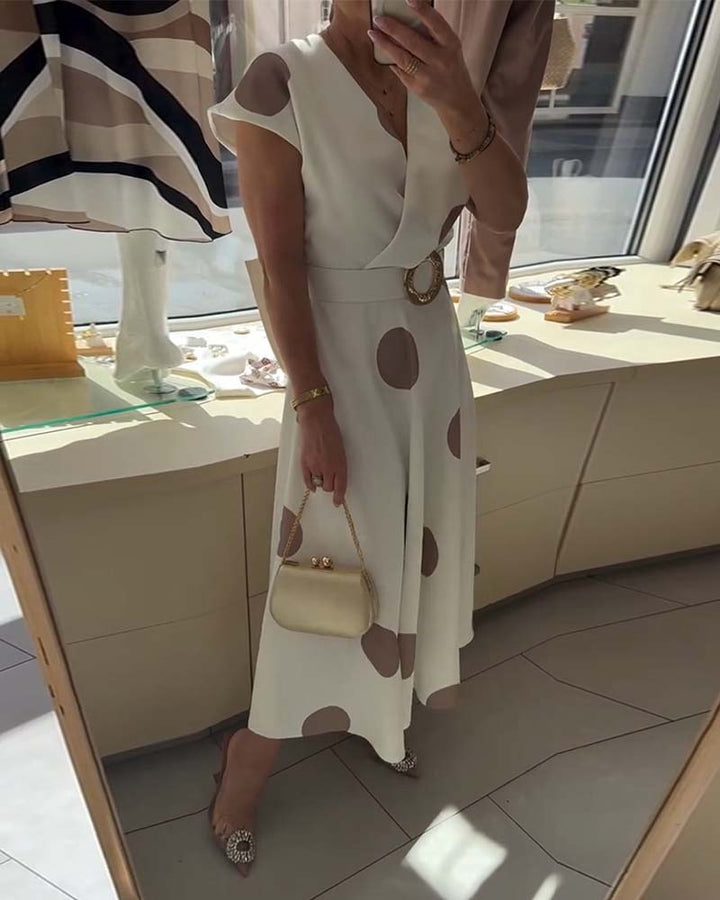 Vestido midi femenino con estampado de lunares, escote en V, ideal para primavera y eventos elegantes.