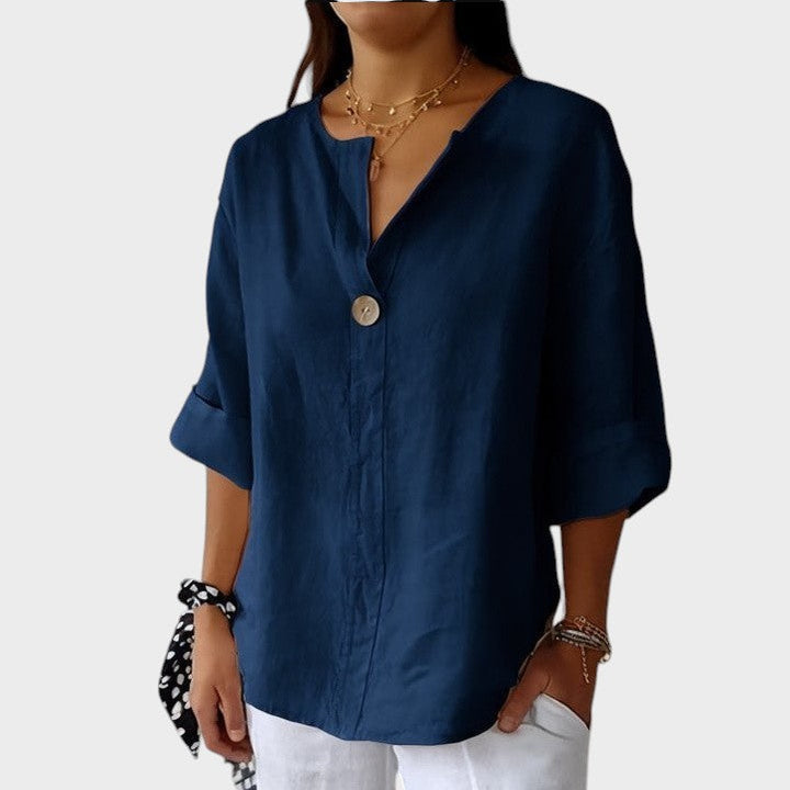Espalda de blusa de lino transpirable para mujer, escote V. Tejido fresco ideal para clima cálido de verano.