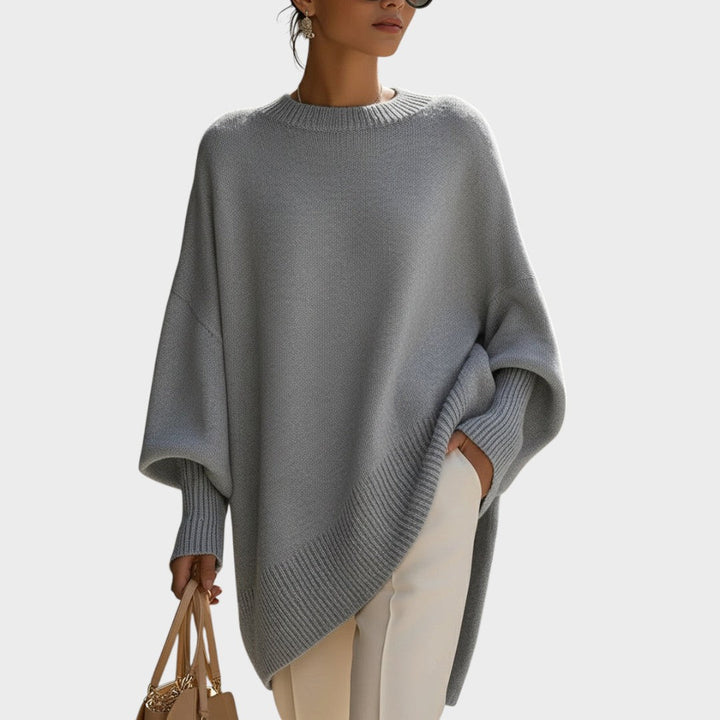 Capa de punto mujer, corte oversize, diseño asimétrico y manga murciélago.
