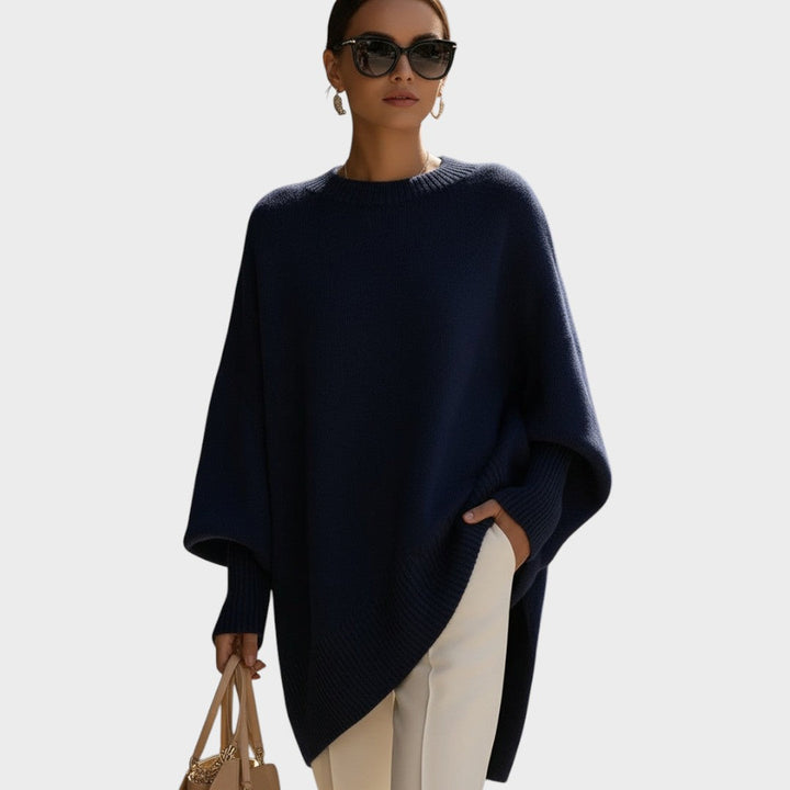 Capa de punto asimétrica y oversize para mujer, con detalle de manga murciélago.