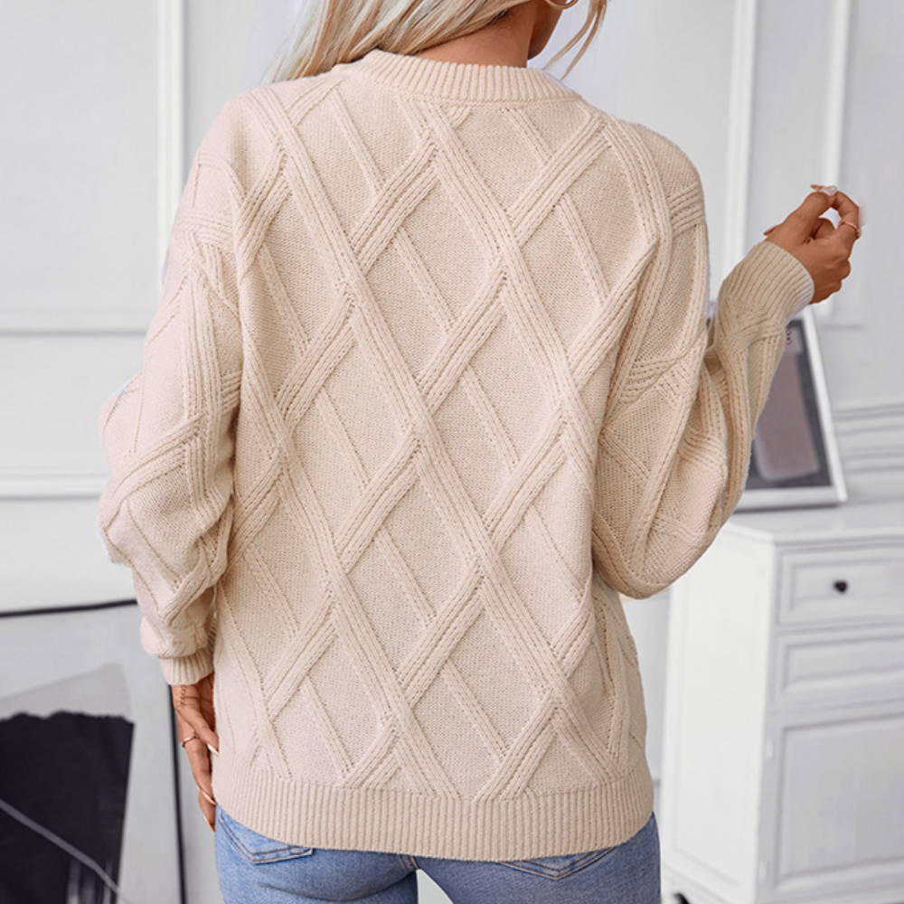 Suéter de mujer con patrón trenzado, cómodo y chic. Aporta calidez y estilo sofisticado en invierno.