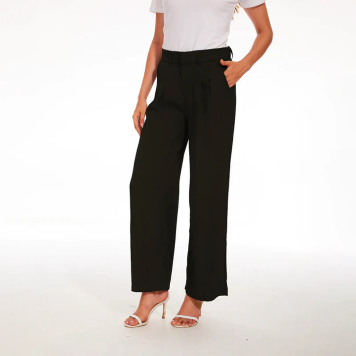 Pantalón de vestir de mujer, talle alto y pierna ancha, fluido y elegante. Perfecto para moda femenina veraniega.
