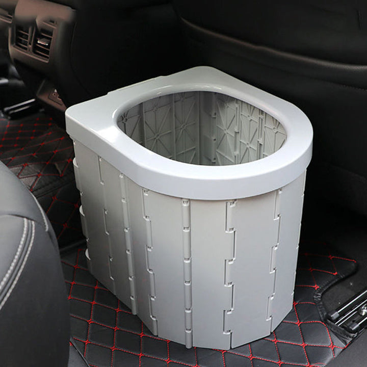 Inodoro portátil plegable resistente para uso en camping, senderismo y exteriores. Fiabilidad garantizada.