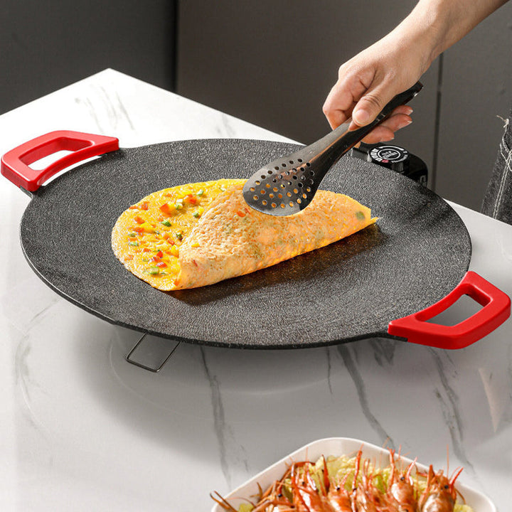 Parrilla eléctrica con tecnología sin humo, ideal para asar en interiores. Superficie antiadherente y gran potencia.