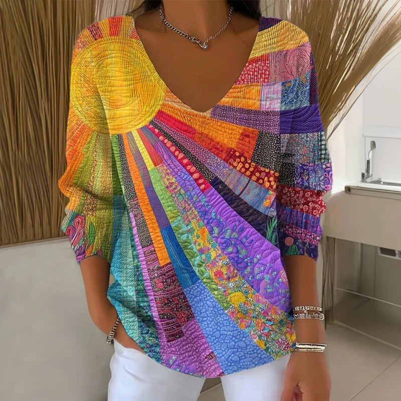 Camiseta vintage multicolor cuello V para mujer, manga larga. Estampado artístico ideal para moda casual y cómoda.