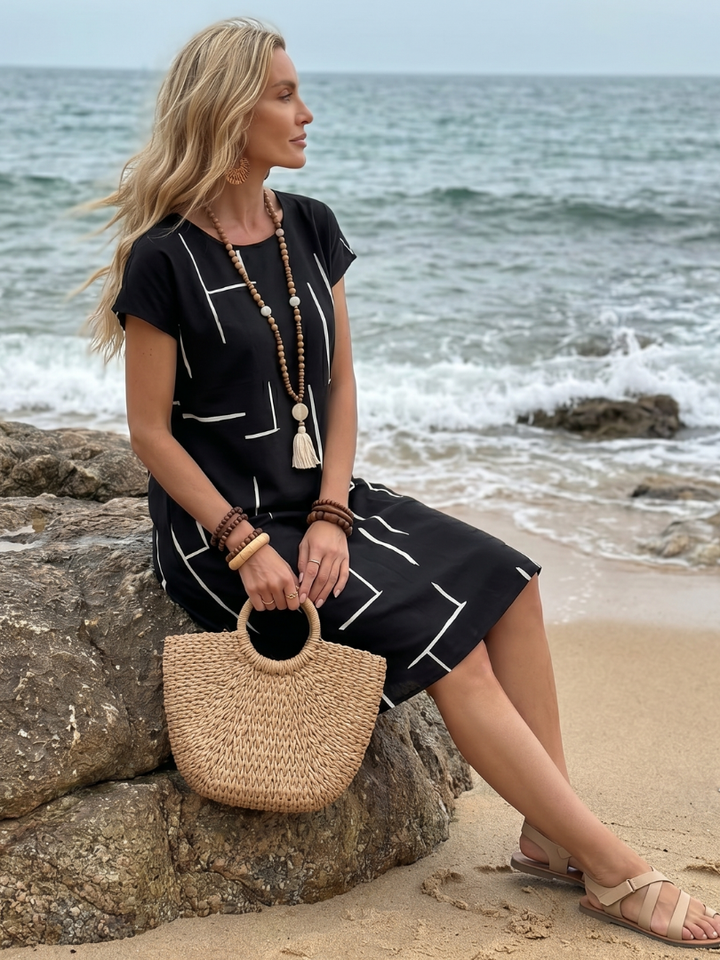 Vestido midi mujer, vista frontal, algodón lino, escote V, estampado geométrico. Estilo veraniego y casual.