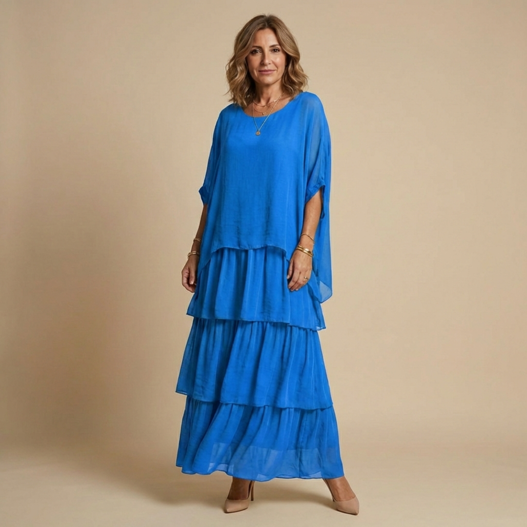 Vestido largo y fluido para mujer, elegante y versátil. Ideal para looks casuales o más formales con manga suelta.