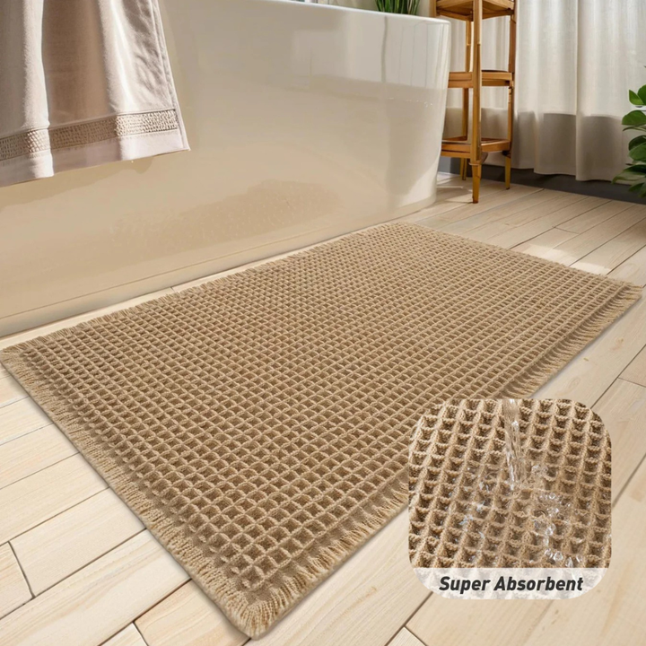 Alfombrilla de baño super absorbente con borlas. Antideslizante, lavable a máquina, diseño waffle.