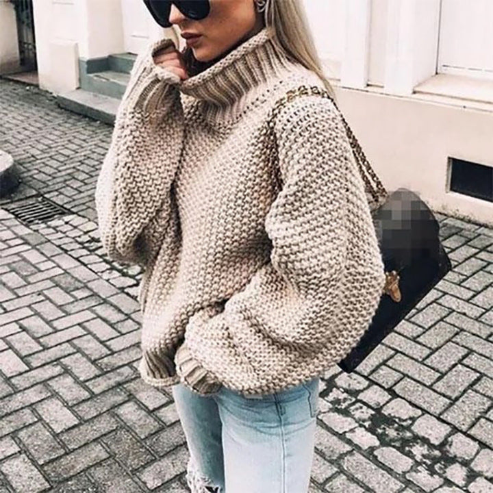 Suéter de punto elegante para mujer, diseño cómodo de cuello redondo, ideal para invierno y moda femenina versátil.