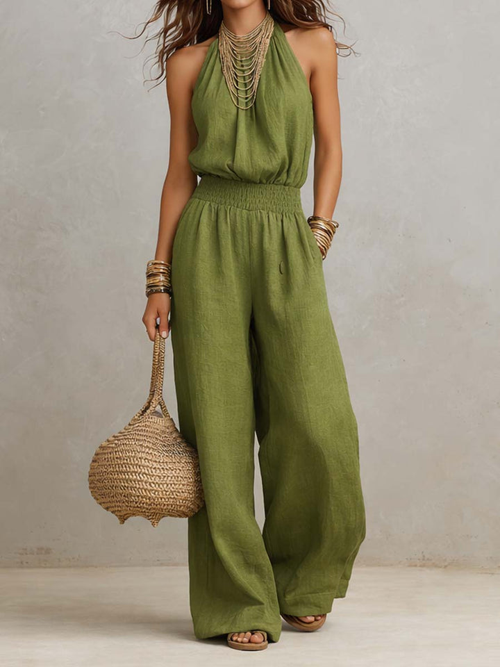Mono de mujer con cuello halter, espalda descubierta y diseño de pierna ancha. Fresco y chic para el verano.