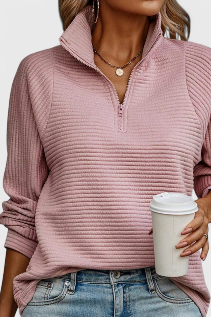 Jersey de manga larga para mujer, cómodo y con estilo casual. Escote en V y cremallera chic.