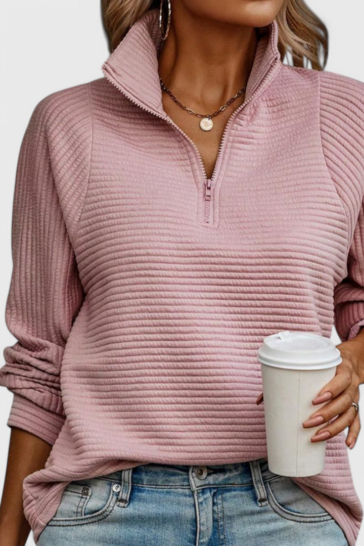 Jersey de manga larga para mujer, cómodo y con estilo casual. Escote en V y cremallera chic.