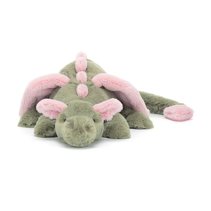 Muñeco de dragón tierno con alas y escamas suaves. Ideal como compañero de juegos.