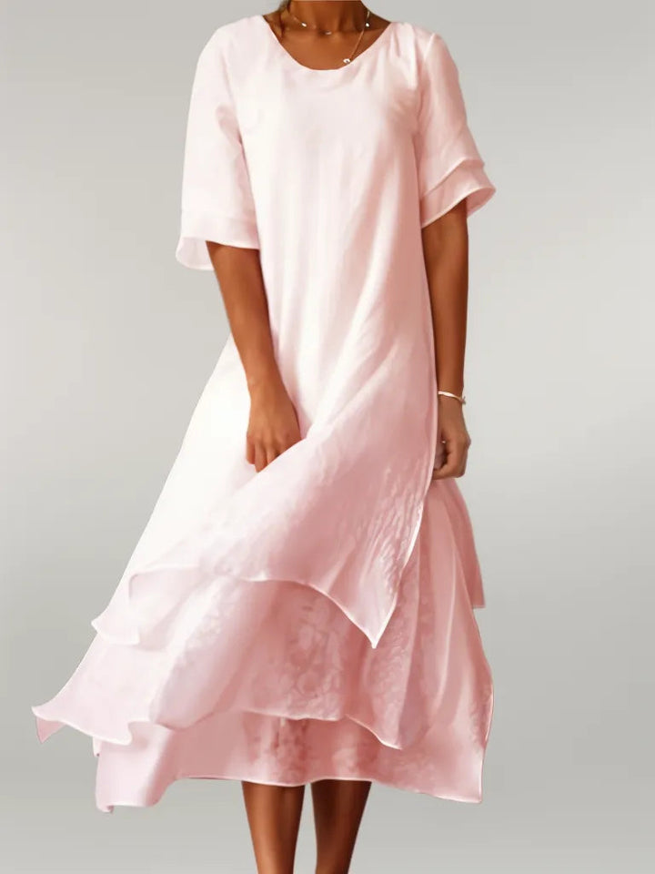 Vestido largo fluido rosa de cuello redondo y manga corta para mujer, ideal para verano casual.
