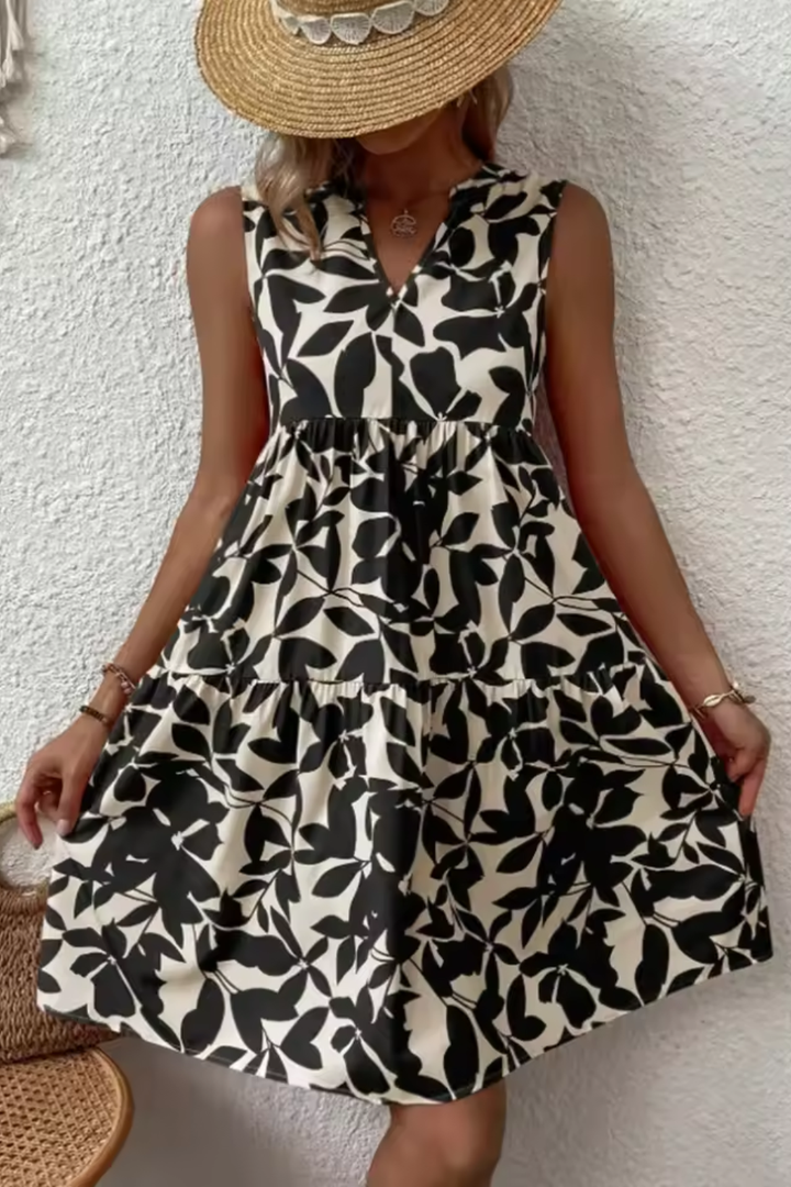 Elegante vestido midi bohemio sin mangas con escote en V para mujer, ideal para verano, playa y casual.