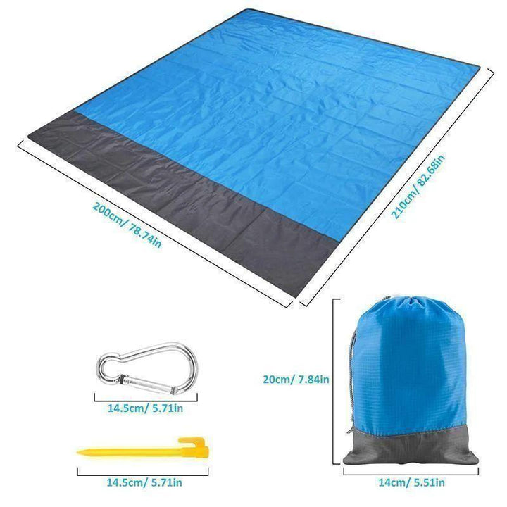 Amplia manta de playa familiar, impermeable y anti-arena para disfrutar cómodamente en el exterior.