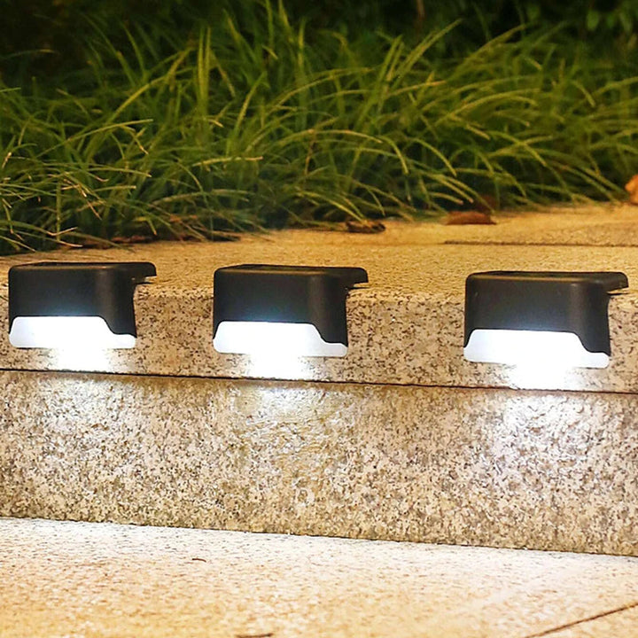 Pack de 4 luces solares LED para escaleras. Iluminación de seguridad exterior para patio y terraza.