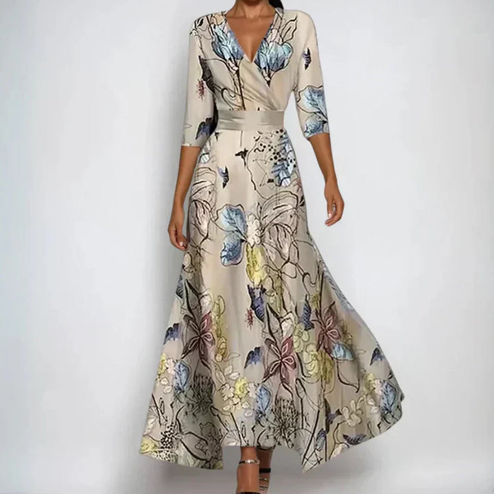 Vestido floral largo de mujer con ajuste envolvente y estampado elegante. Perfecto para eventos casuales de verano.