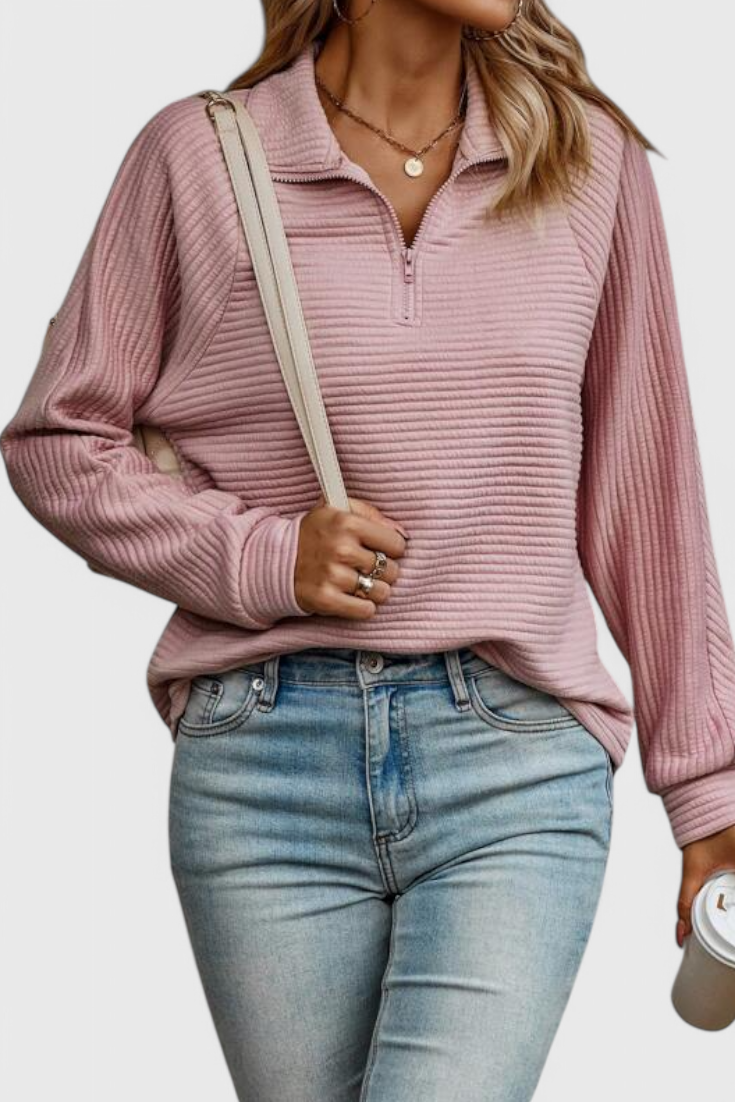 Suéter casual de mujer con cremallera frontal y manga larga. Prenda versátil para comodidad diaria.