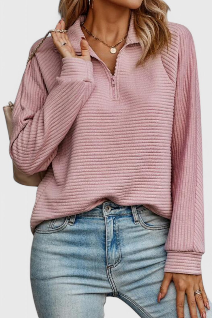 Jersey elegante de mujer con escote en V y cremallera. Perfecto para un look sofisticado y versátil.