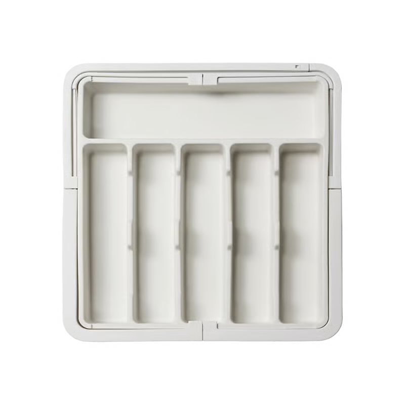 Organizador de cajón extensible y ajustable para un almacenamiento eficiente en cocina y oficina.