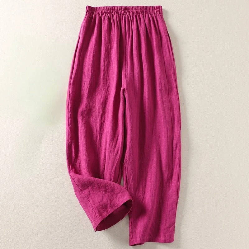 Pantalones de mujer de lino algodón con cintura elástica. Corte fluido y relajado, esencial para ropa de verano cómoda.