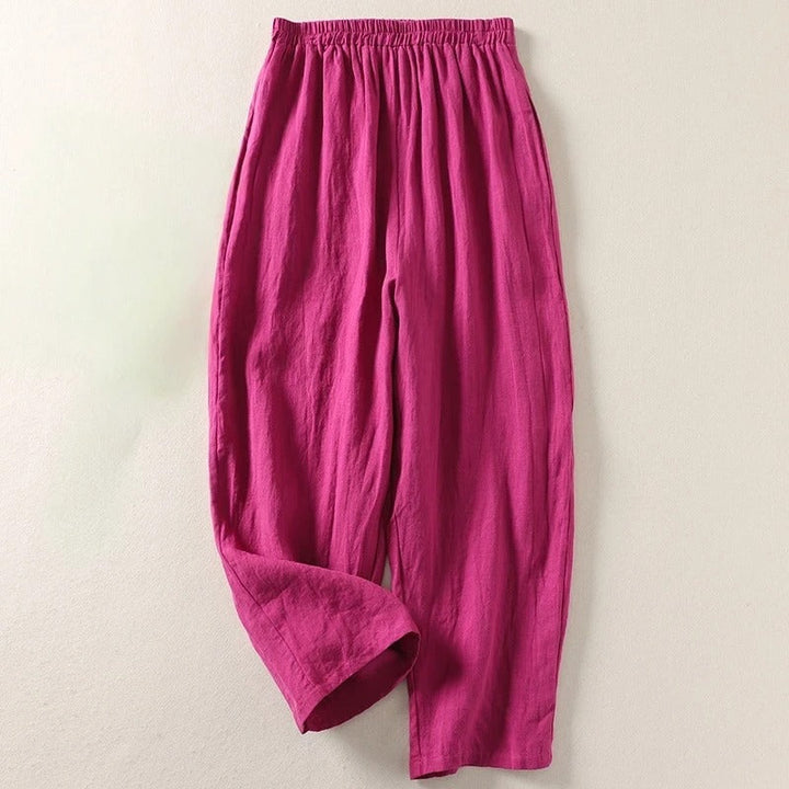 Pantalones de mujer de lino algodón con cintura elástica. Corte fluido y relajado, esencial para ropa de verano cómoda.