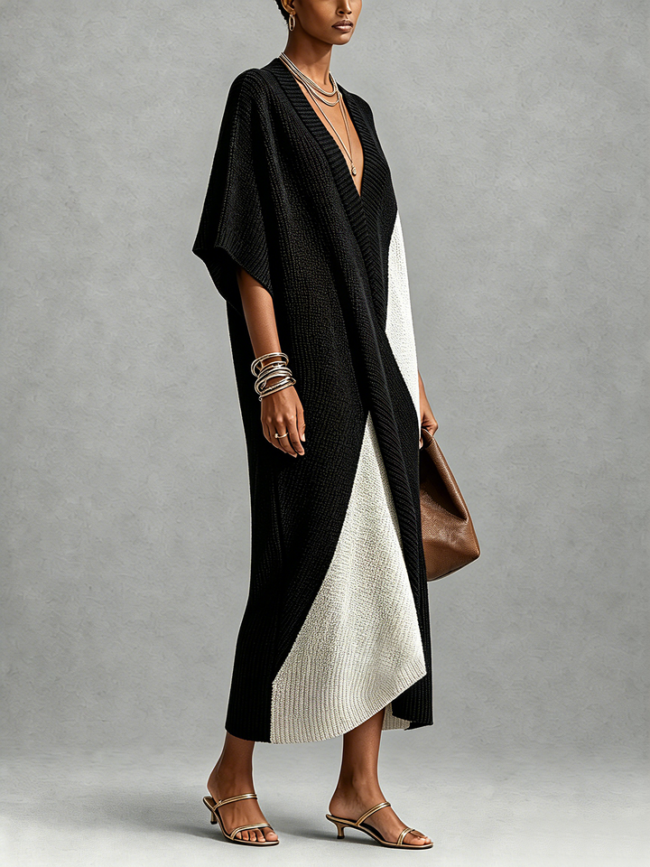 Mujer con vestido midi bicolor casual chic, escote en V. Diseño moderno, perfecto para primavera y verano.