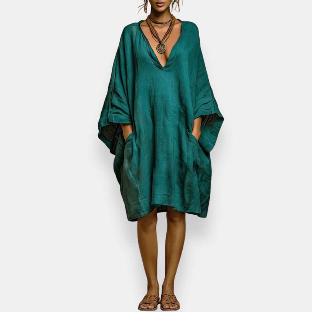 Vestido oversize bohemio de mujer con escote V, manga murciélago y bolsillos. Ideal para verano y playa.