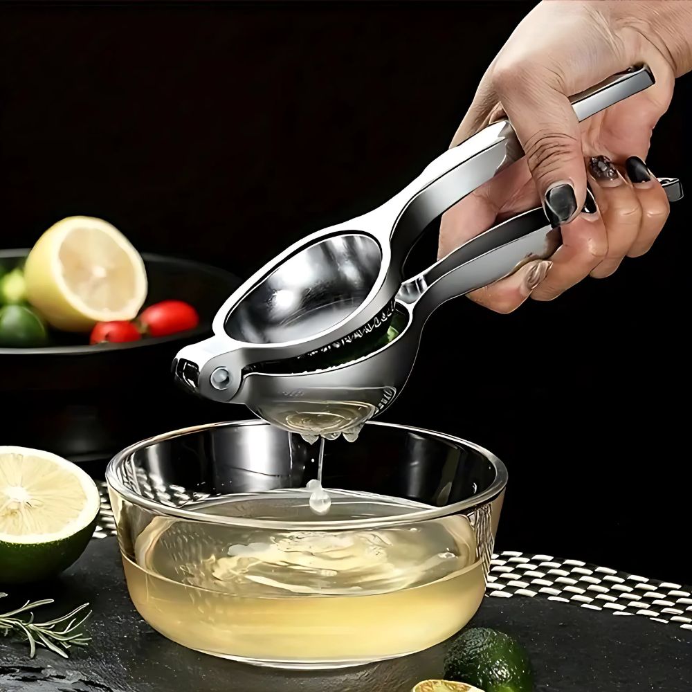 Exprimidor manual de cítricos de acero inoxidable para cocina, ideal para exprimir limón, lima y naranja frescos.