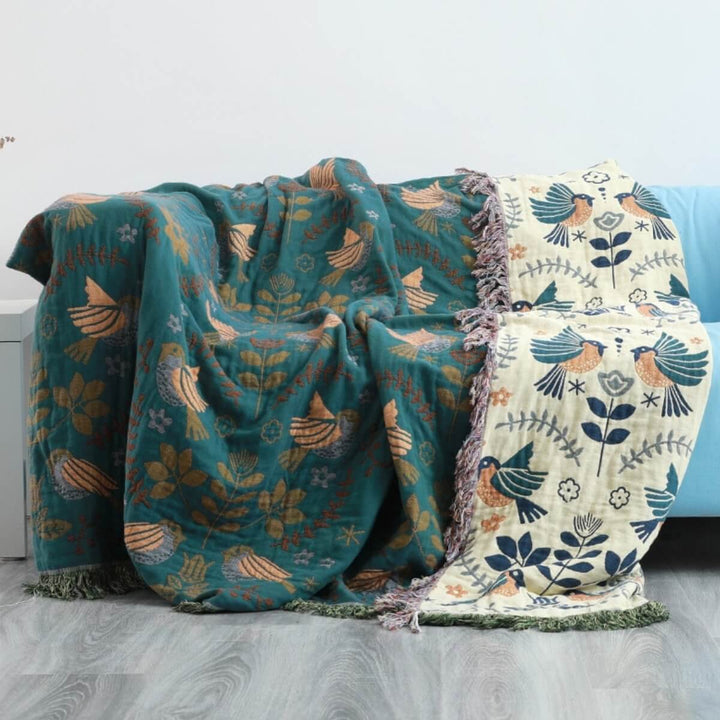 Manta de hogar versátil, reversible, estilo escandinavo con diseño de pájaros, 100% algodón para máximo confort.