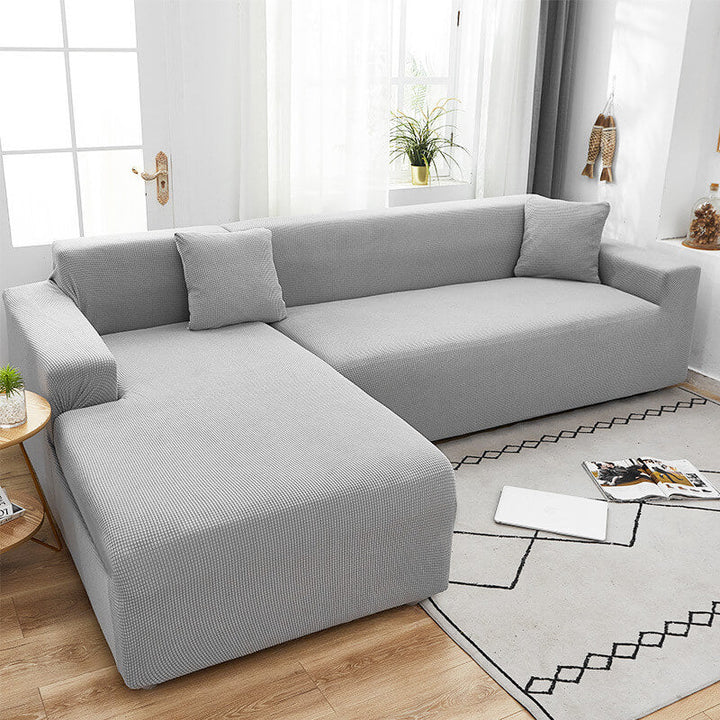 Cubierta de sofá elástica y moderna. Protector de muebles impermeable, para una sala de estar elegante.