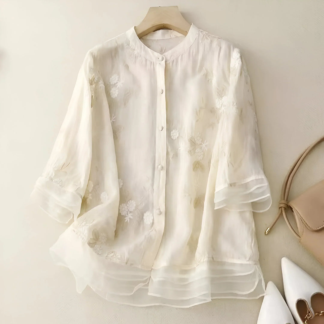 Blusa de mujer Giovanna con diseño floral, hecha de algodón ligero. Prenda esencial para un estilo fresco y femenino.