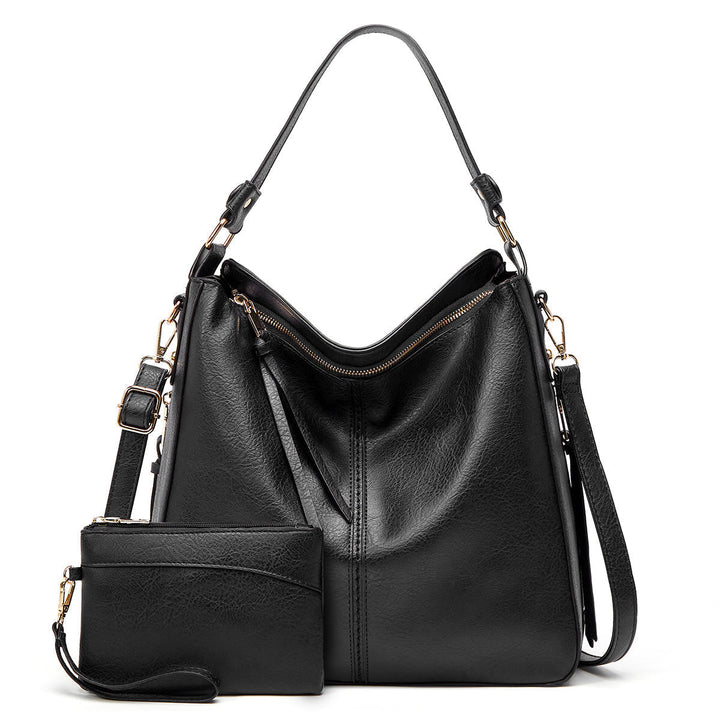 Set de bolsos femeninos: bandolera de uso diario y clutch sofisticado en piel sintética.