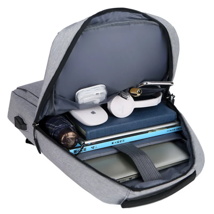 Mochila urbana moderna unisex gris, elegante y versátil, ideal para laptop y viajes seguros.