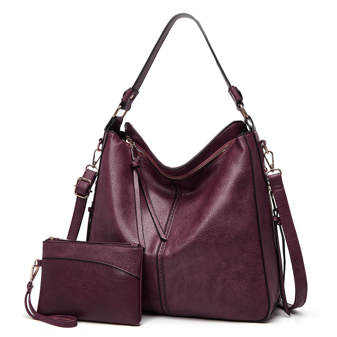 Moda mujer: set de bandolera y bolso de muñeca en piel sintética, diseño atemporal.