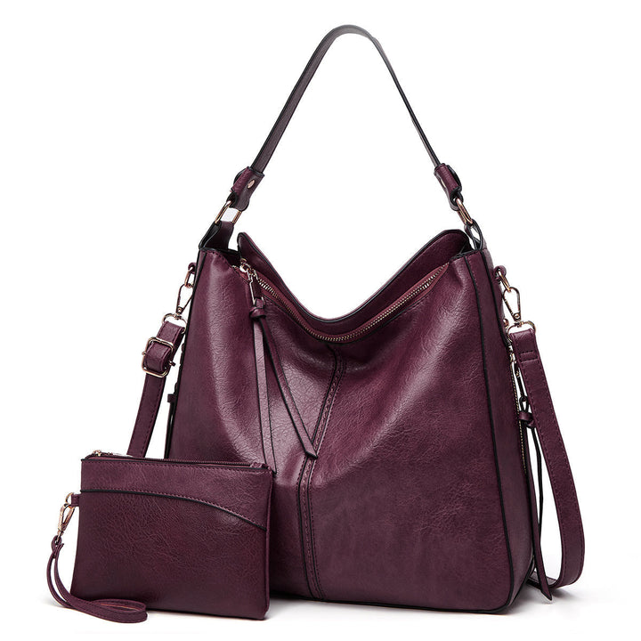 Moda mujer: set de bandolera y bolso de muñeca en piel sintética, diseño atemporal.