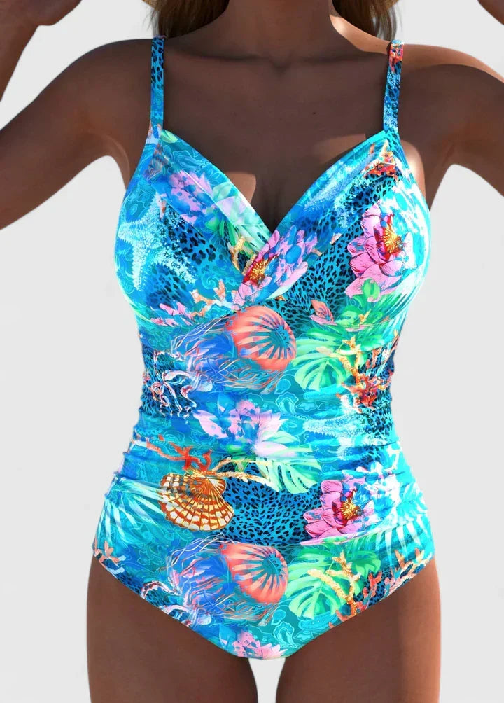 Bañador de mujer tropical con estampado vibrante y escote V. Diseño de una pieza, efecto moldeador estilizador.