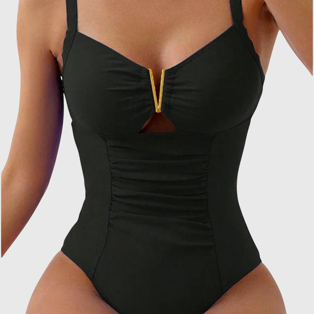 Bañador moldeador de mujer con escote V, realza la figura. Perfecto para un verano chic en la playa.
