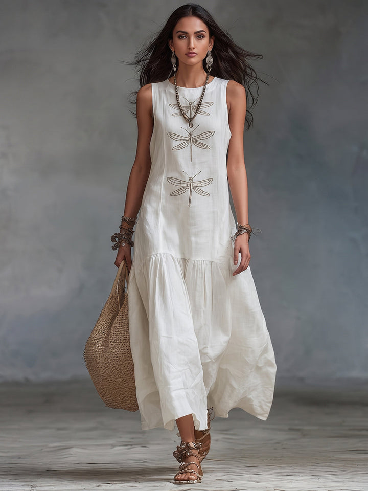 Vestido largo de mujer, lino y algodón, con vibrante bordado de libélulas. Ideal para un look casual de verano.