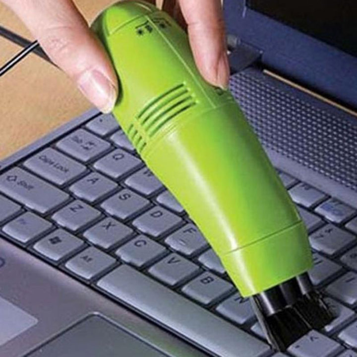 Aspiradora mini USB compacta para limpieza de teclados, laptops y dispositivos electrónicos. Elimina polvo.