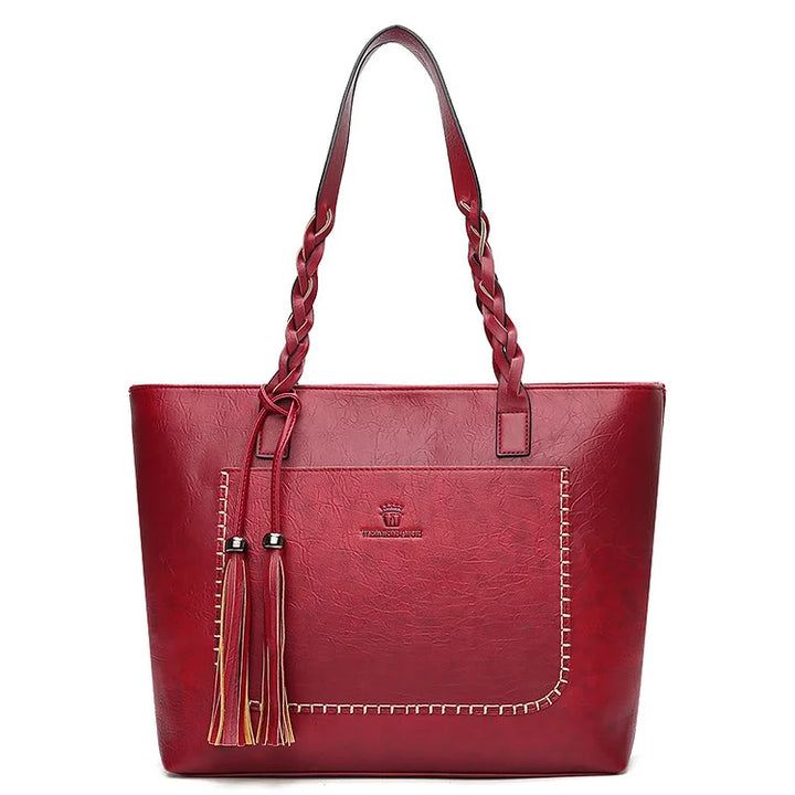 Bolso de mujer estructurado con base firme, asas cómodas y amplio espacio interior. Perfecto para diario.