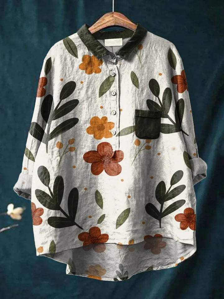 Mujer vistiendo camisa oversize de algodón, estampado floral vibrante, ideal para casual de primavera.